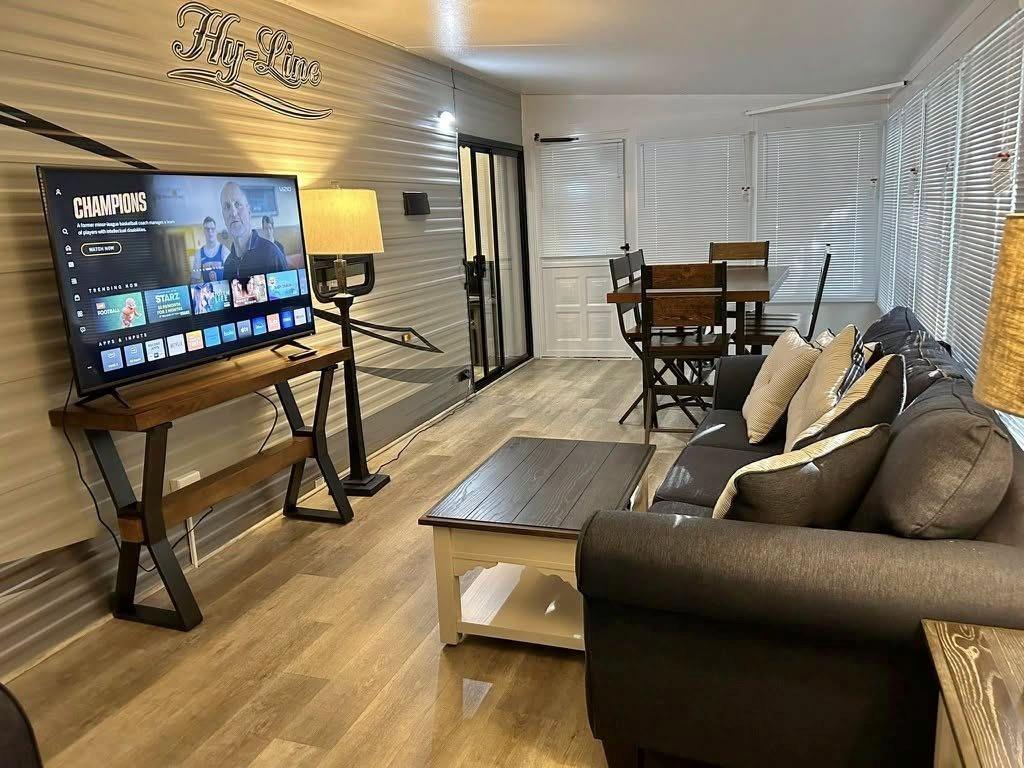Hy-Line Florida room with a sofa, television, and dining table